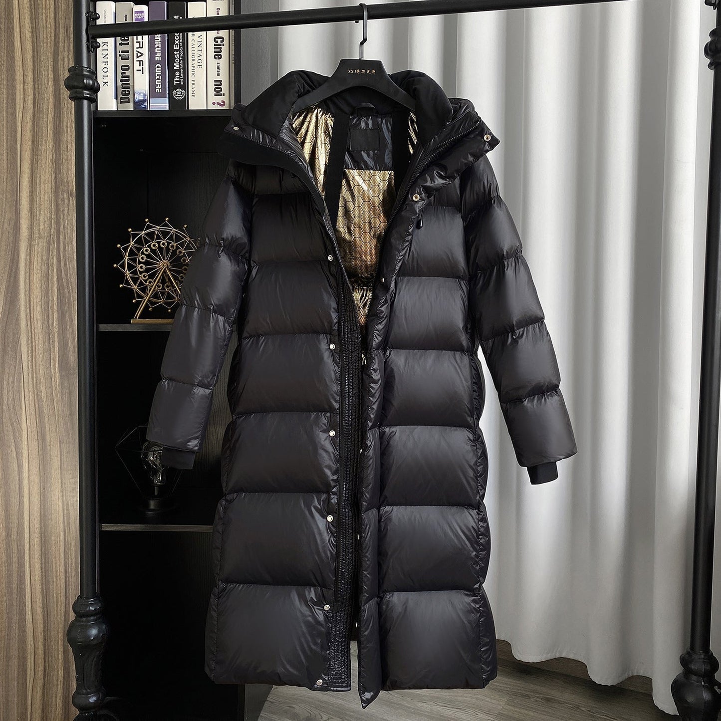 Extra-long quilted coat with hood and shiny finish