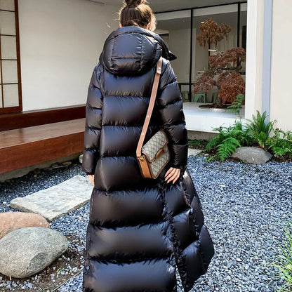 Extra-long quilted coat with hood and shiny finish